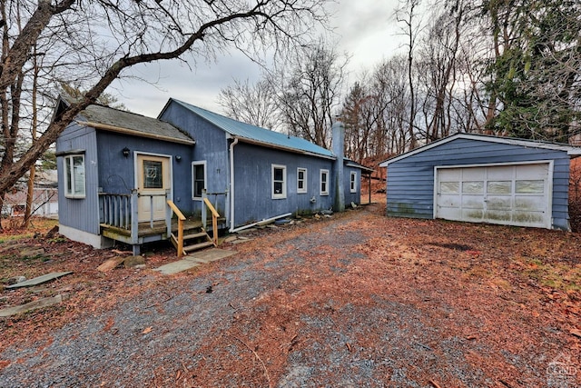 view of front of home featuring an outdoor structure and a garage