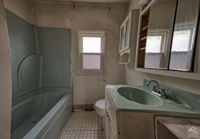 full bathroom featuring shower / tub combination, vanity, and toilet