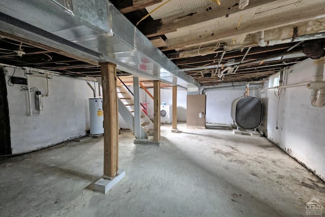 basement with washer / clothes dryer and water heater