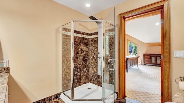 bathroom with a shower with shower door