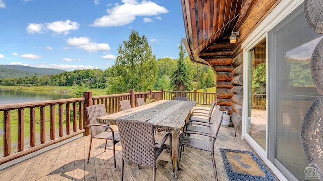 wooden deck with a water view