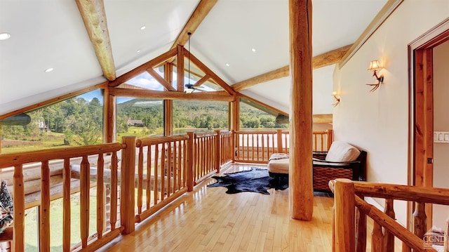 interior space with vaulted ceiling with beams