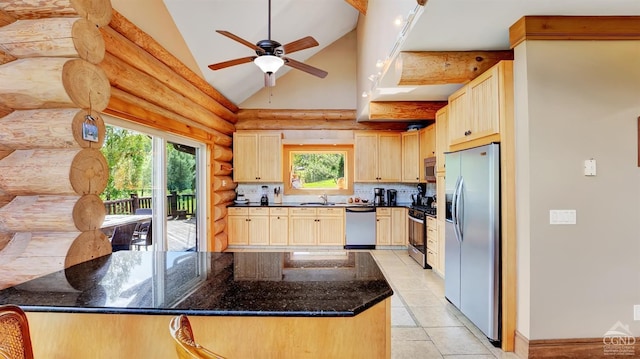 kitchen with dark stone counters, ceiling fan, light brown cabinetry, tasteful backsplash, and stainless steel appliances