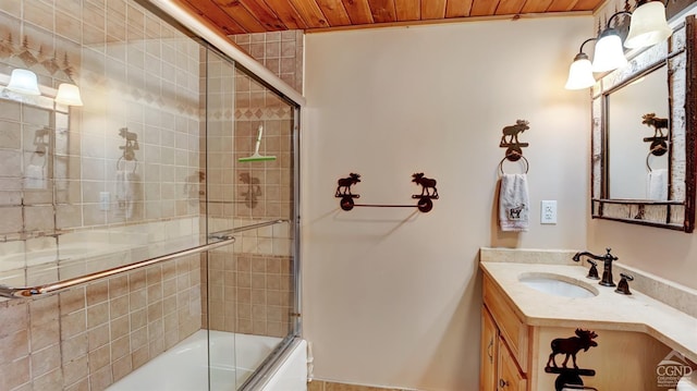 bathroom featuring vanity, wood ceiling, and bath / shower combo with glass door