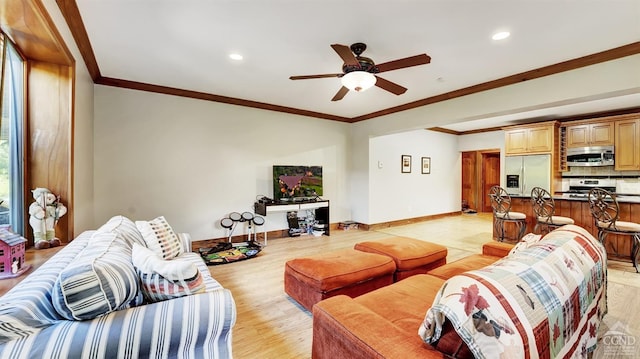 living room with light wood-type flooring, ceiling fan, and crown molding