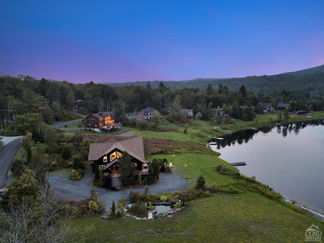 aerial view at dusk with a water view