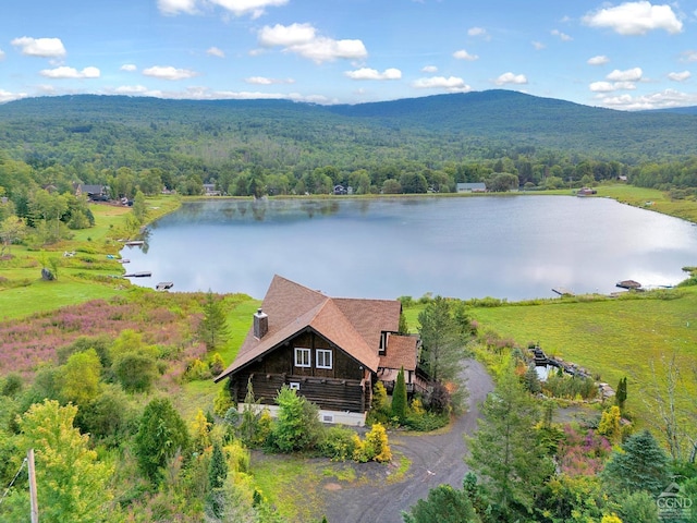 bird's eye view with a water and mountain view