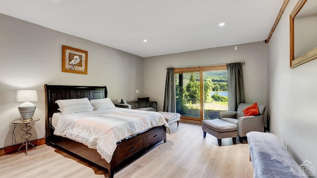 bedroom with access to outside and light hardwood / wood-style flooring