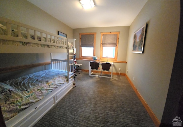 bedroom featuring dark colored carpet