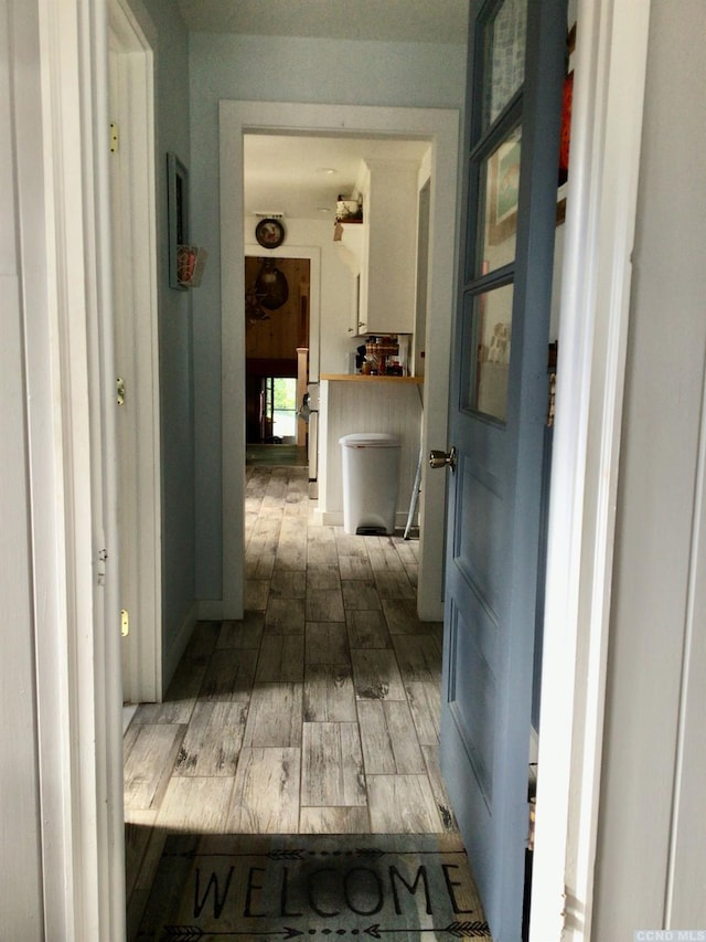 hall featuring wood finished floors