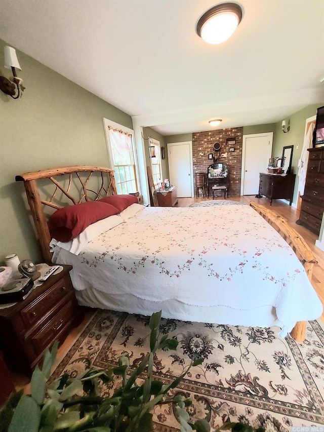 bedroom with wood finished floors