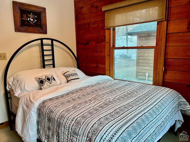 carpeted bedroom featuring baseboards