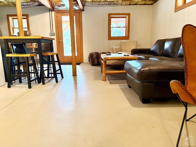 living area with concrete floors