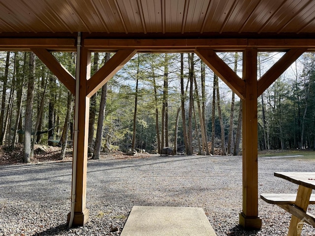 exterior space featuring a wooded view