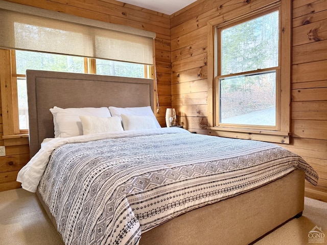 bedroom with wood walls