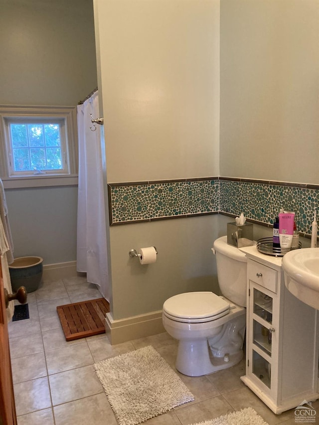 bathroom featuring tile patterned floors and toilet