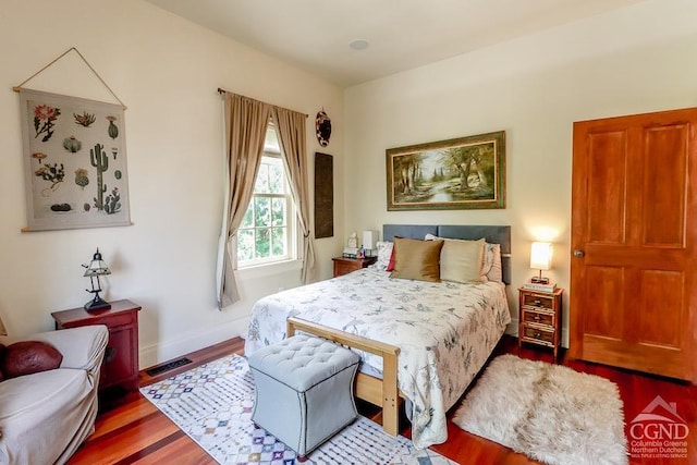 bedroom with hardwood / wood-style flooring