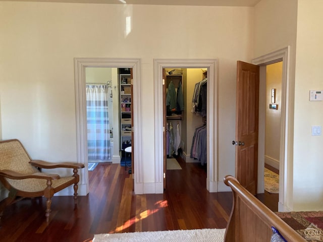 corridor with dark wood-type flooring