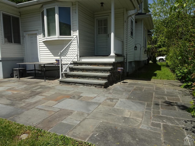 entrance to property featuring a patio