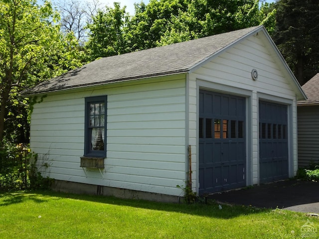 garage with a yard