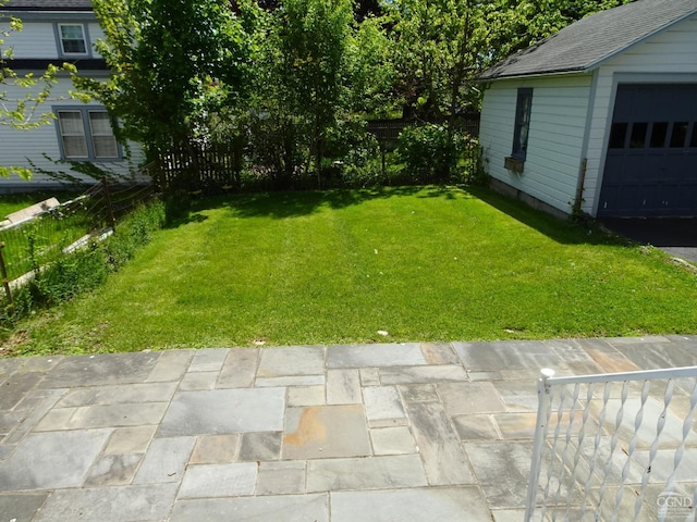 view of yard featuring a patio area and an outdoor structure