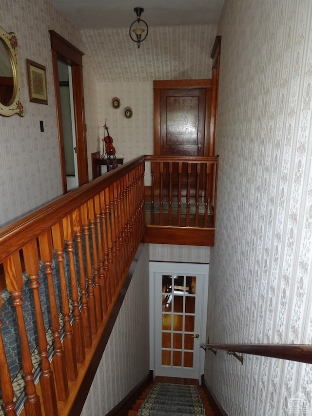 stairway featuring hardwood / wood-style floors