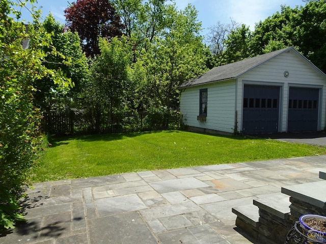 garage featuring a yard