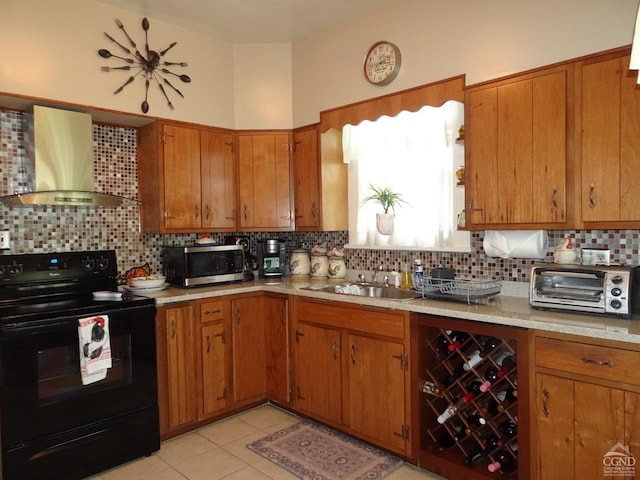 kitchen featuring electric range, wall chimney exhaust hood, backsplash, and sink