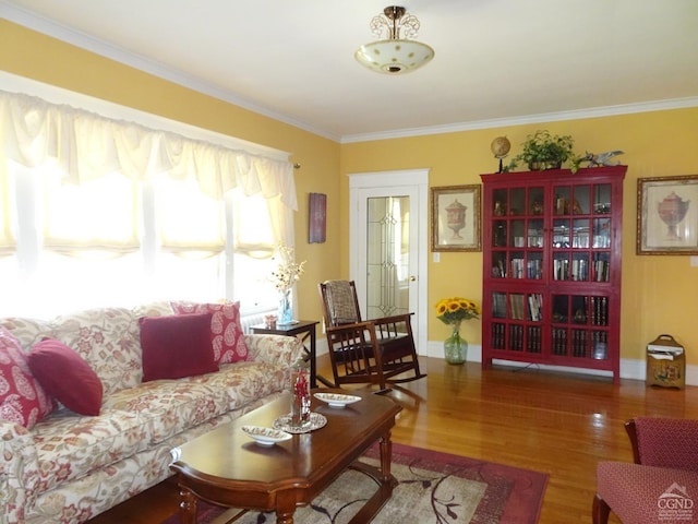 living room with dark hardwood / wood-style flooring and ornamental molding