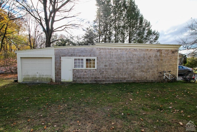 garage with a yard