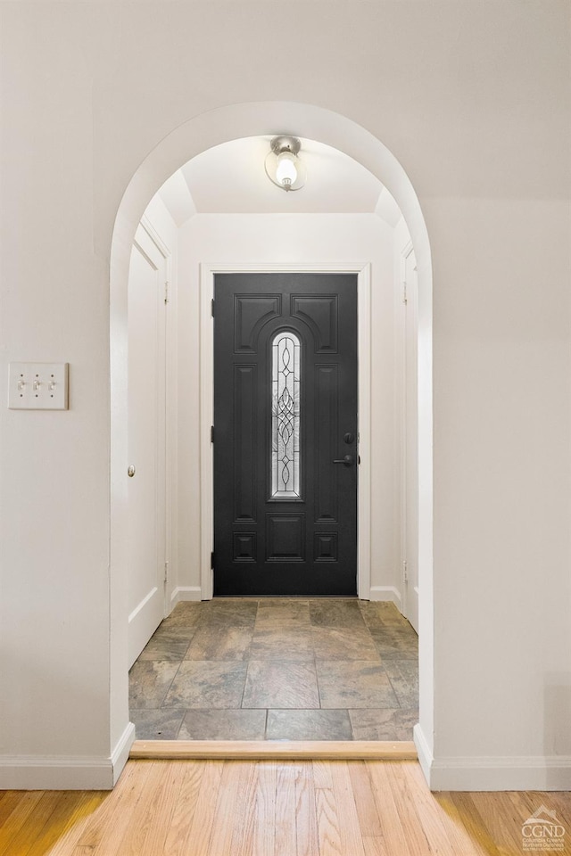 foyer entrance featuring hardwood / wood-style floors