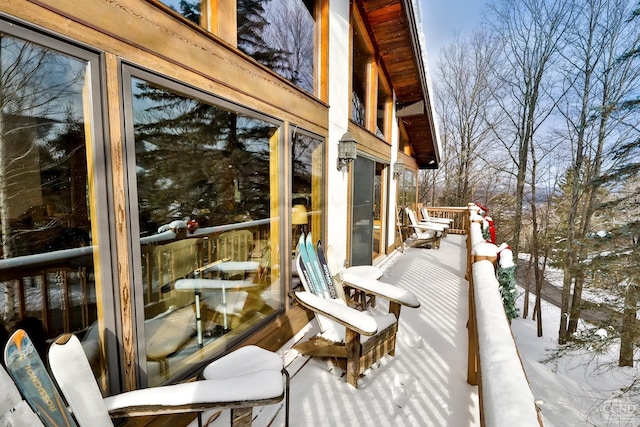 view of snow covered deck