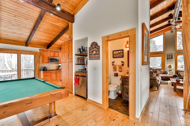 rec room featuring high vaulted ceiling, beam ceiling, light wood-type flooring, and billiards