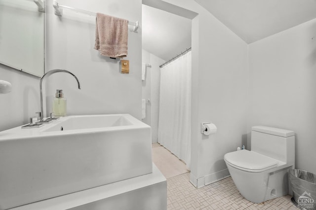 bathroom featuring tile patterned floors and toilet