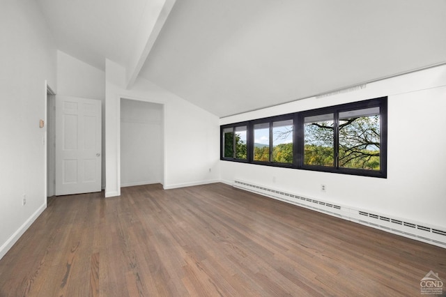 interior space with hardwood / wood-style flooring, lofted ceiling with beams, and a baseboard radiator