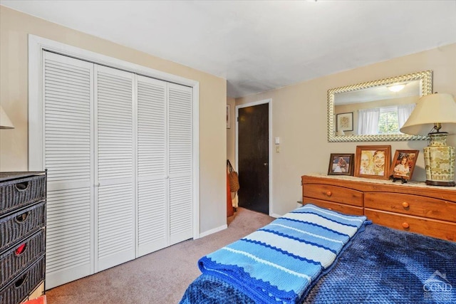 carpeted bedroom with a closet