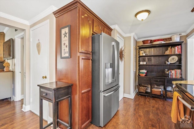 kitchen featuring brown cabinetry, baseboards, dark wood finished floors, stainless steel fridge with ice dispenser, and ornamental molding