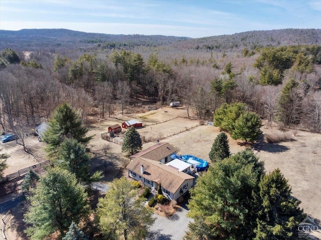 aerial view featuring a view of trees