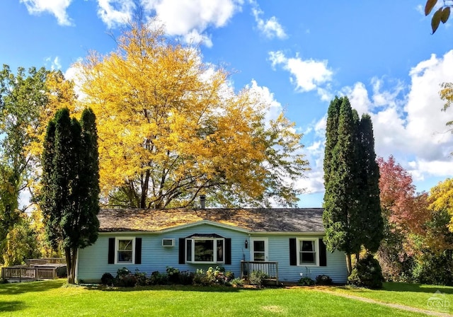 ranch-style home featuring a front yard