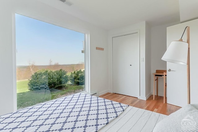 unfurnished bedroom with wood finished floors