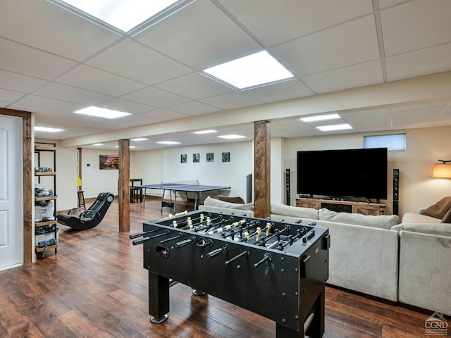 rec room featuring a paneled ceiling and dark hardwood / wood-style floors