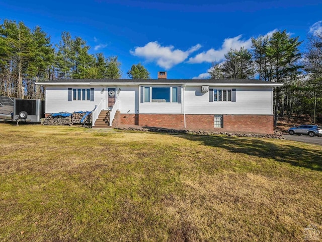 ranch-style home with a front lawn