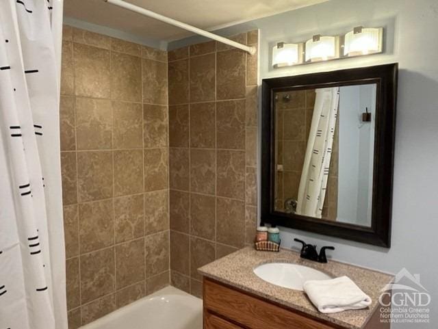 bathroom with vanity and shower / bathtub combination with curtain