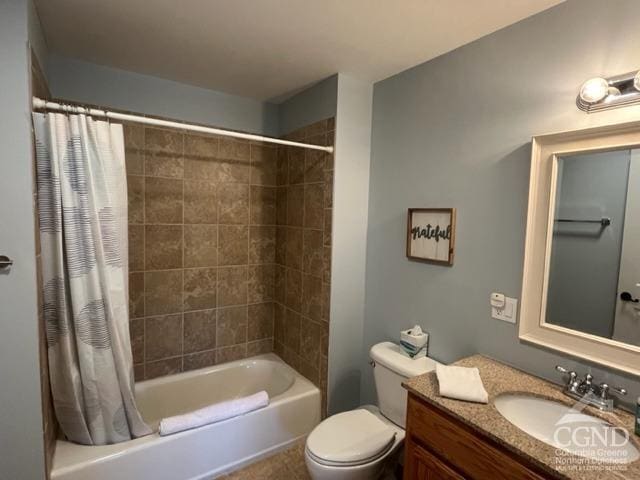 full bathroom featuring vanity, shower / bath combination with curtain, and toilet