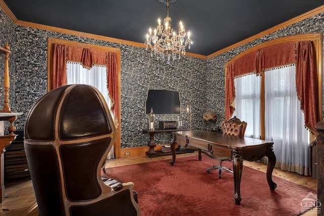 home office featuring hardwood / wood-style flooring, a notable chandelier, and ornamental molding