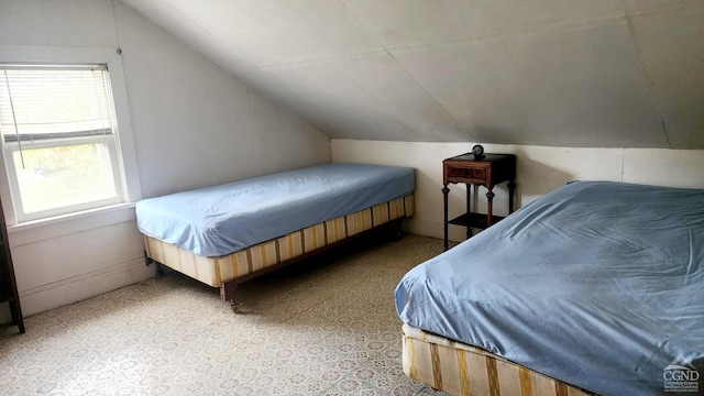 bedroom featuring lofted ceiling