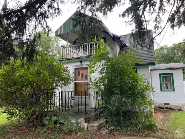 rear view of house with a balcony