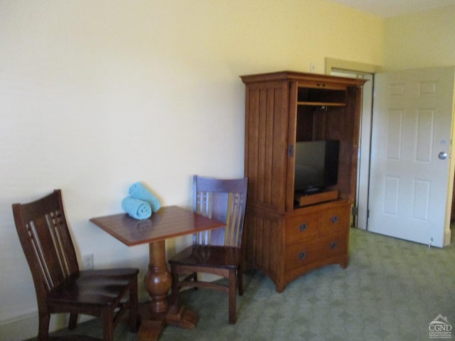 dining area with light colored carpet