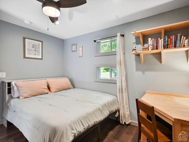 bedroom featuring dark hardwood / wood-style floors and ceiling fan