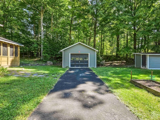 exterior space with an outbuilding and a garage